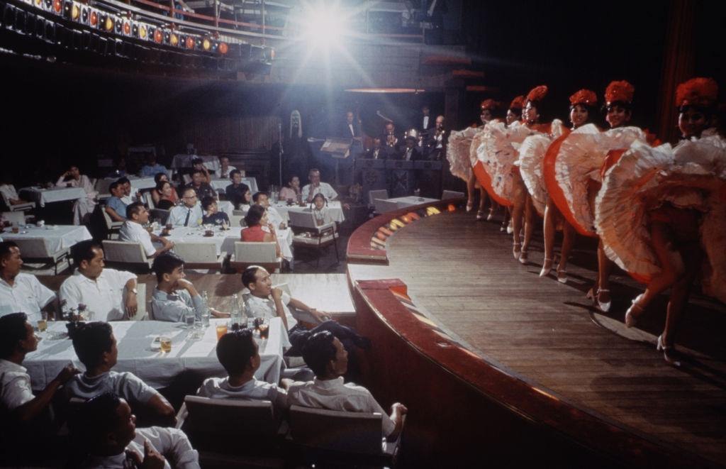 #70 Audience watching a theater dance performance, Vietnam, April 1969.