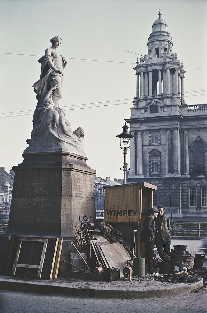 #12 Two workmen by the Titanic Memorial outside Belfast City Hall, 1955.
