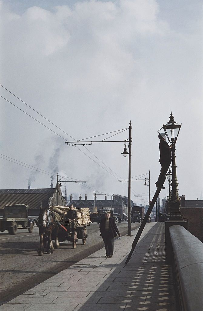 #5 A horsedrawn cart crossing a bridge in Belfast, 1955.