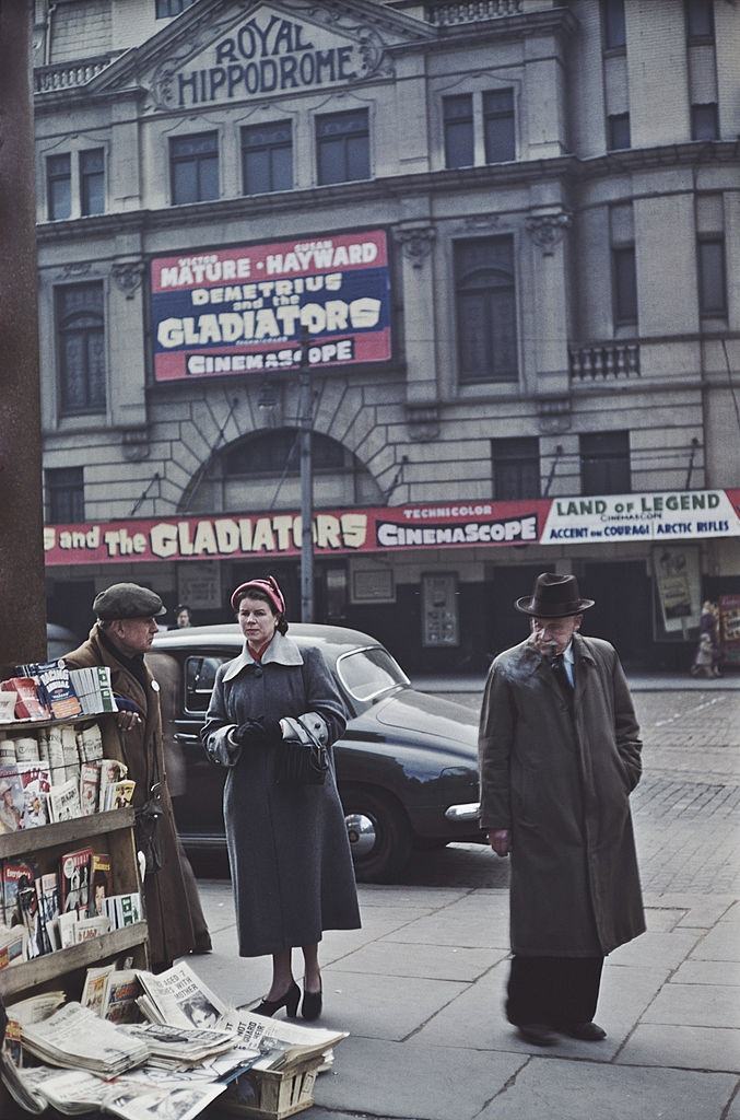 #6 Customers at a news stand opposite the Royal Hippodrome cinema, Victoria Street, Belfast, 1955.