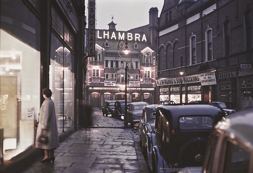 #7 A view down a street towards the Alhambra Theatre in Lower North Street, 1955.