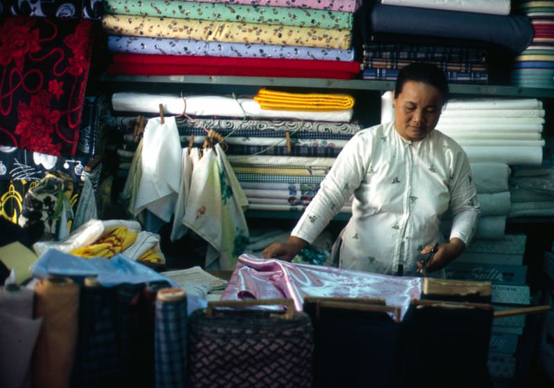 #24 Measuring silk for an Ao Dai in Can Tho, 1968
