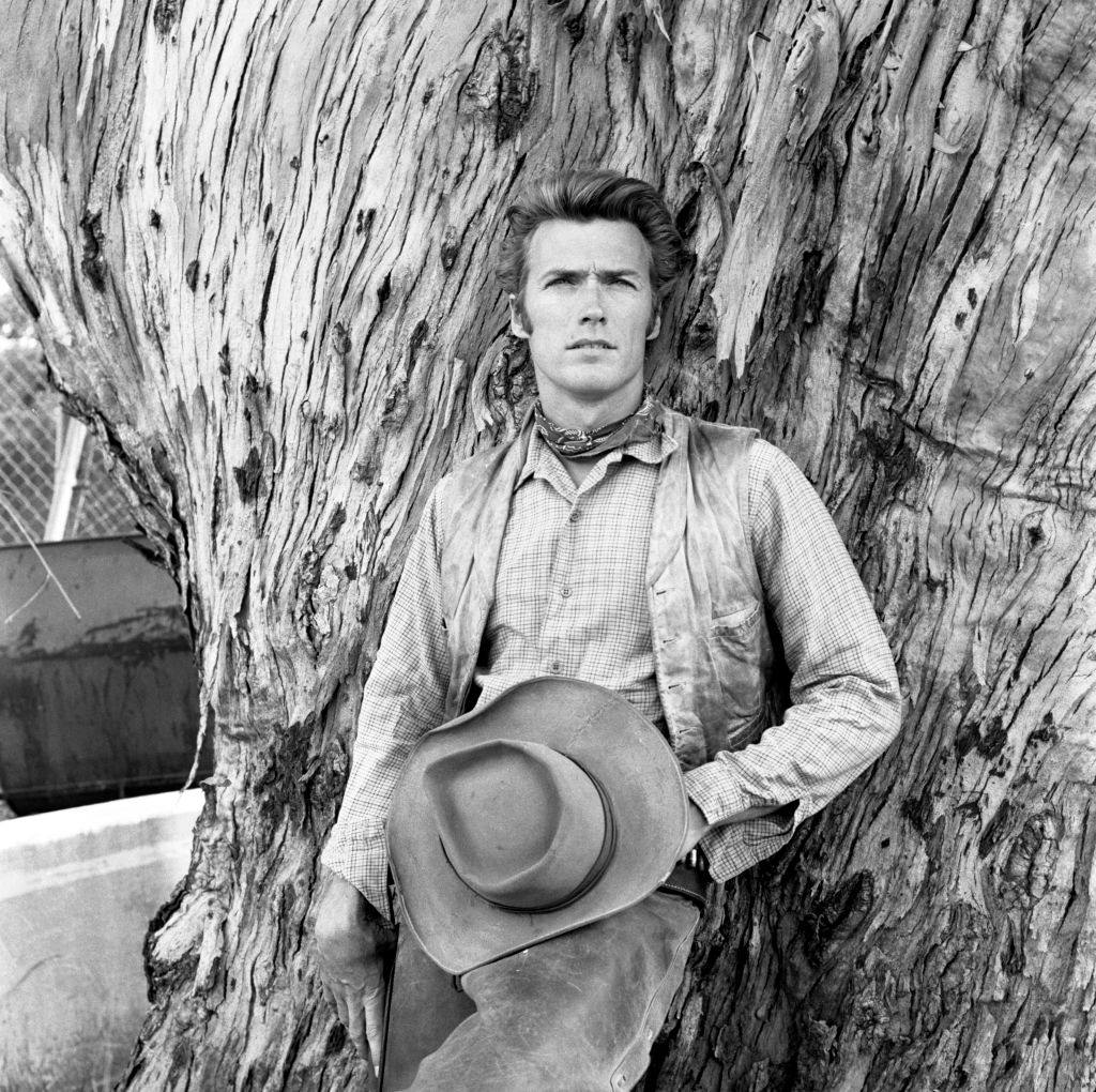 #29 Clint Eastwood posing by a tree, 1960.