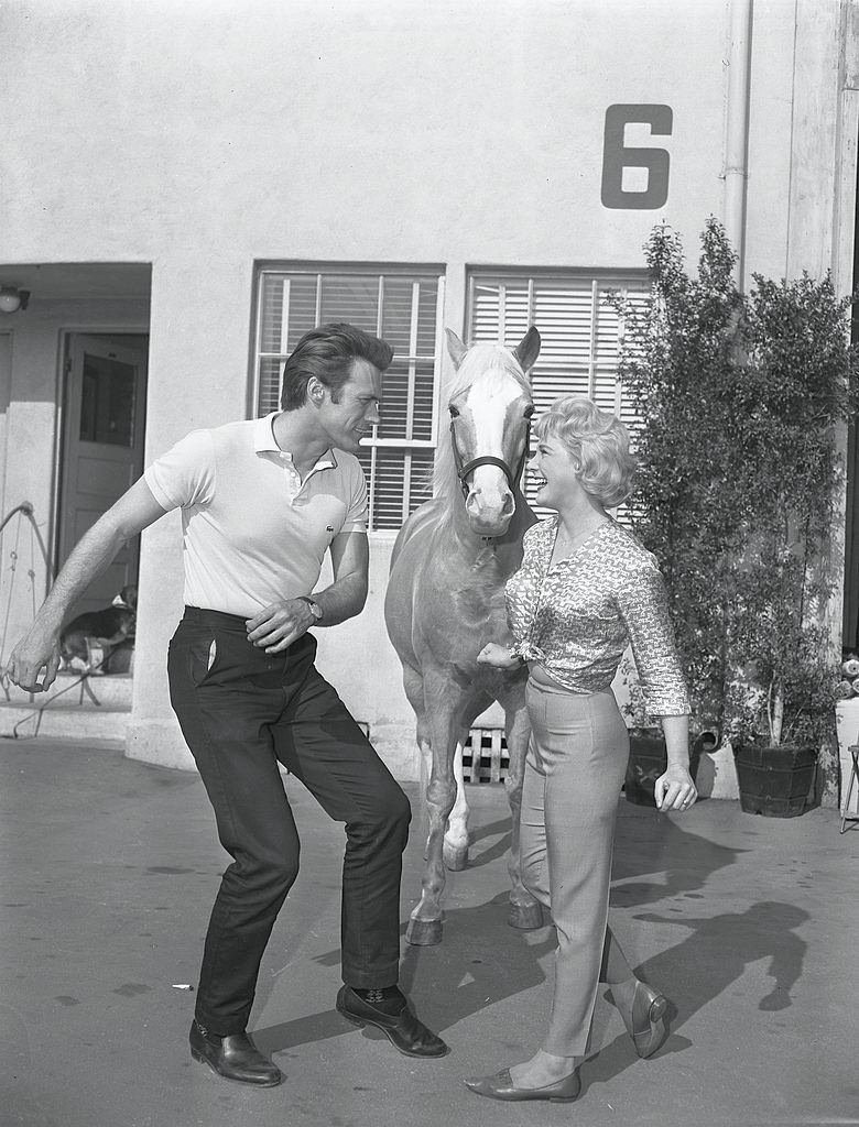#34 Clint Eastwood dances with television actress Connie Hines as horse Bamboo Harvester, 1962.