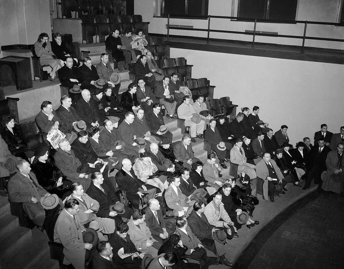 Friends and relatives of persons missing after the Cocoanut Grove Night Club fire in Boston wait in the Amphitheater at the city’s Southern Mortuary.