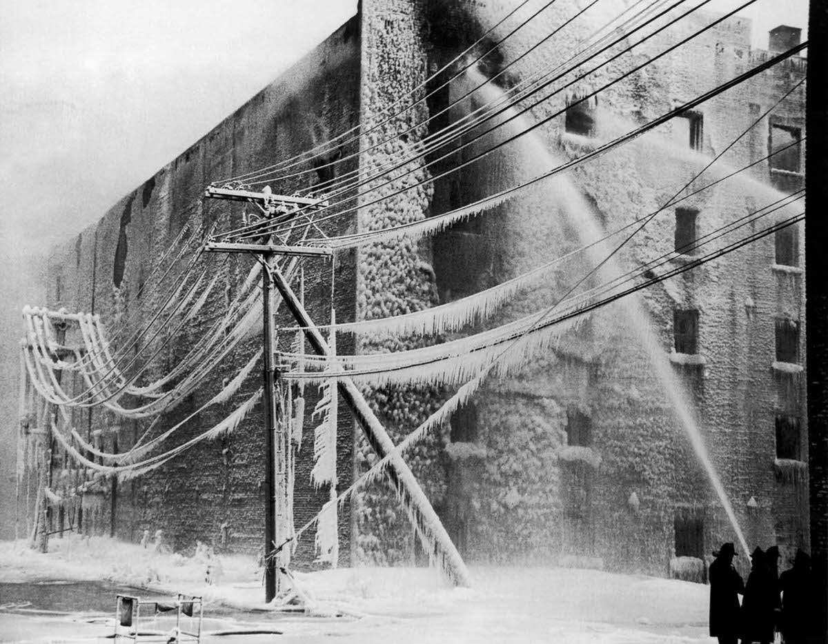 #9 Firefighters battle a blaze in Albany, New York, 1940.