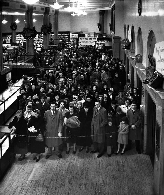 #6 Shoppers waiting to be allowed on the floor.