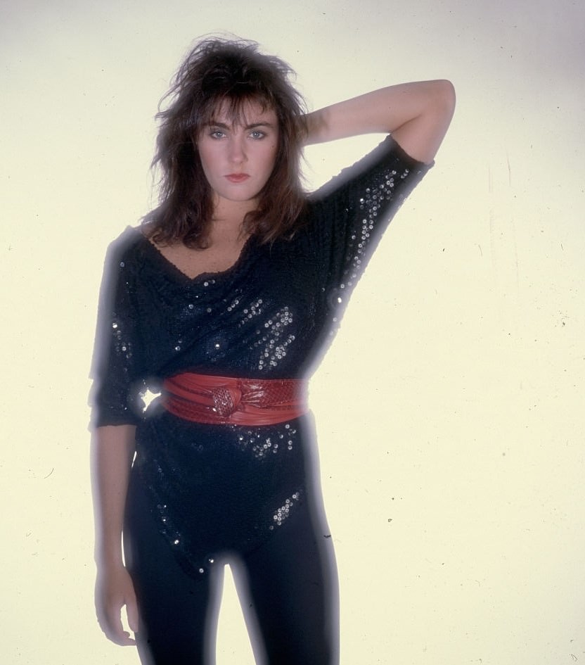 #33 Laura Branigan with one hand behind her head, 1980.