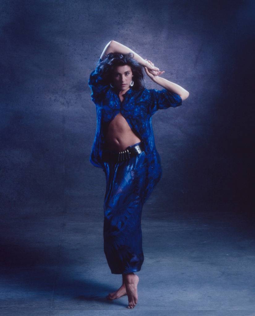 #53 Laura Branigan posing in blue dress, 1985.