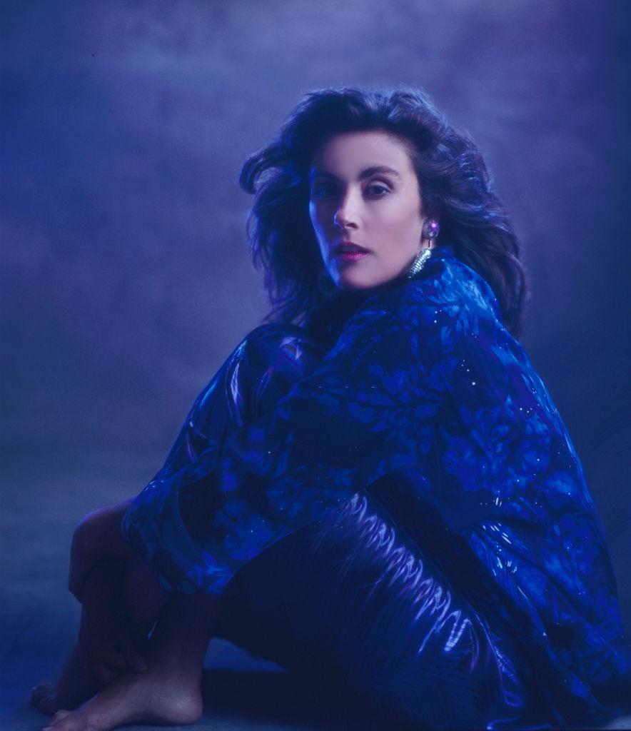 #19 Laura Branigan posing in blue dress, 1985.