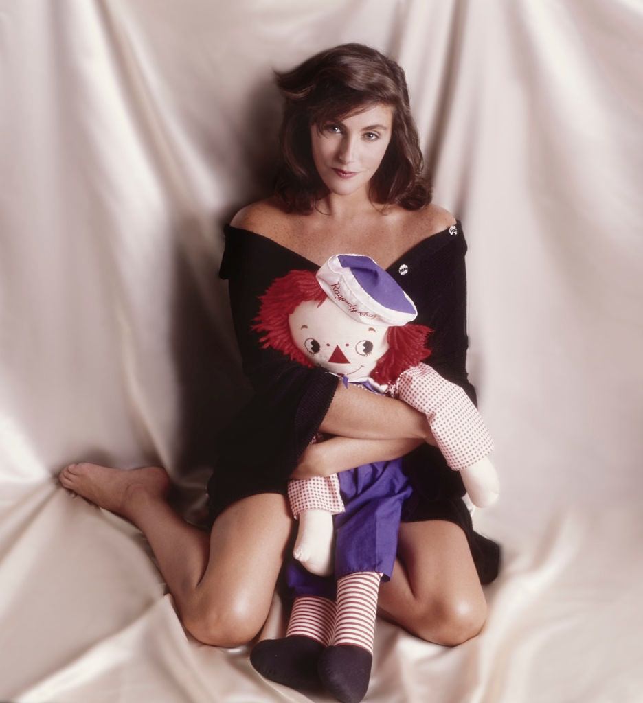 #54 Laura Branigan with a doll, 1985.