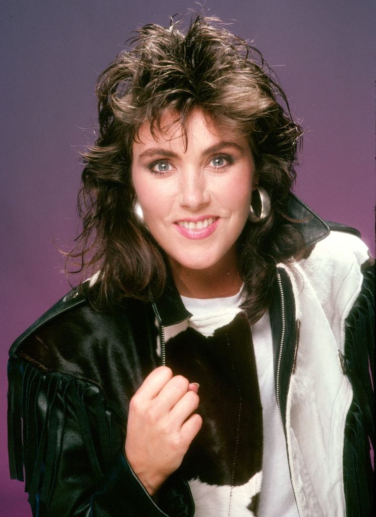 #55 Laura Branigan in black jacket, 1985.