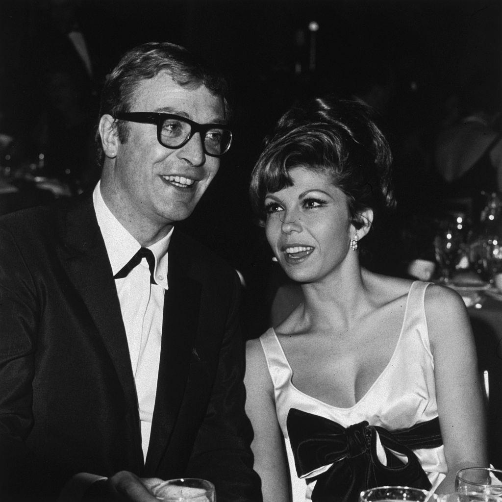 #36 Nancy Sinatra with Michael Caine at the premiere party for Martin Ritt’s film, ‘The Spy Who Came in from the Cold’, 1965.