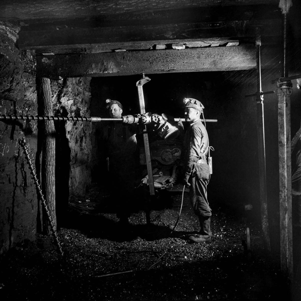 #3 Miners drill a hole for blasting.