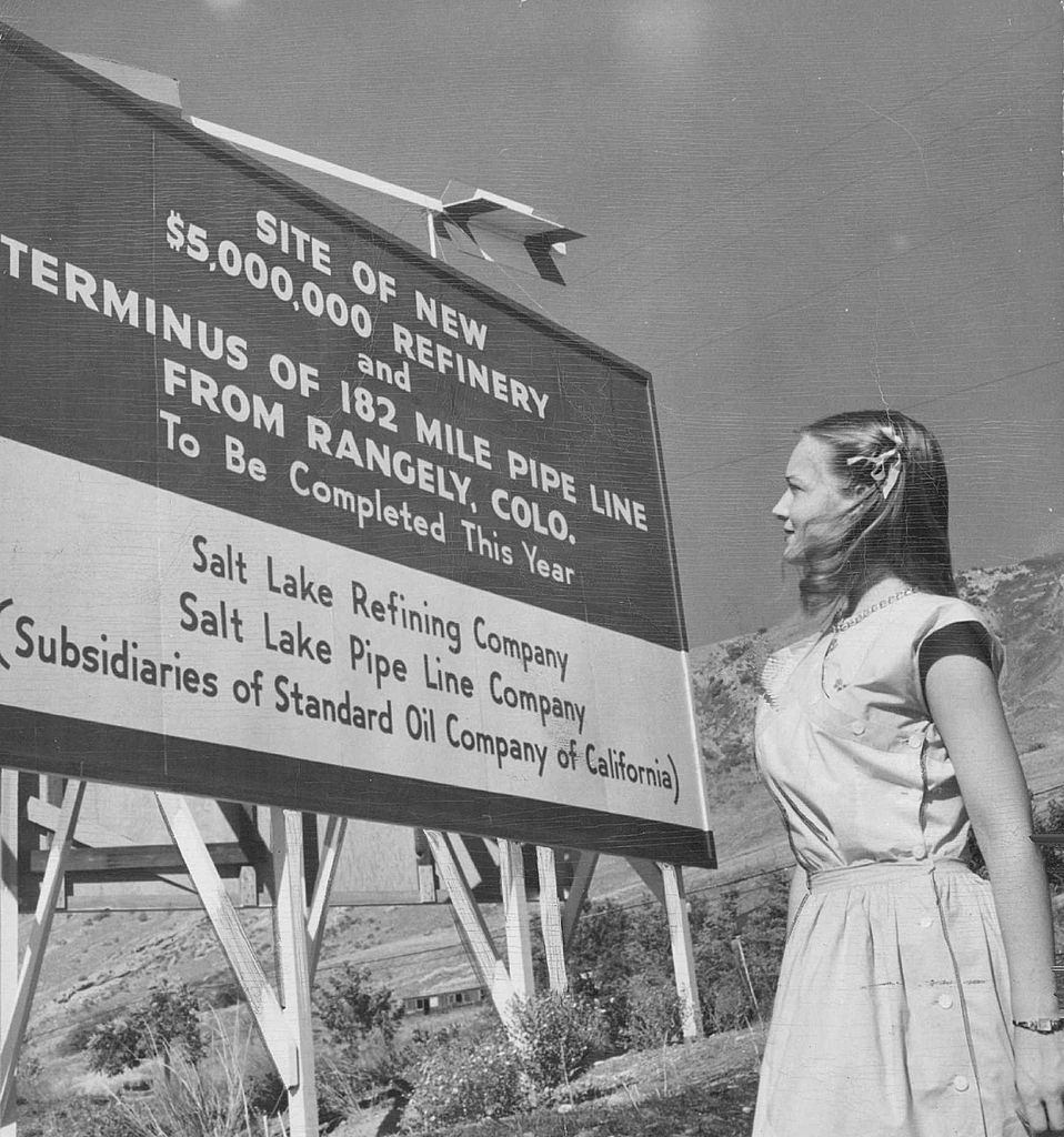 #34 Jerry Stewart of Salt lake city reads a sign announcing the construction of a new multi million dollar refinery which will process crude oil production of Colorado’s rich Rangely oil field