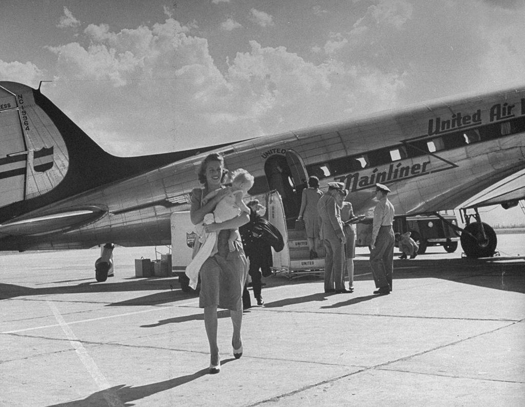#22 Passengers exiting the airplane after landing in Salt Lake City, 1945.