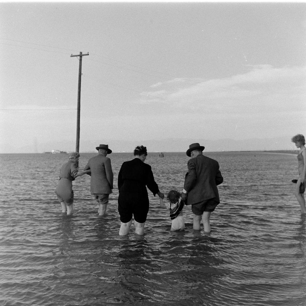 #7 People walking on the Great Salt Lake, Salt Lake City, June 1948.
