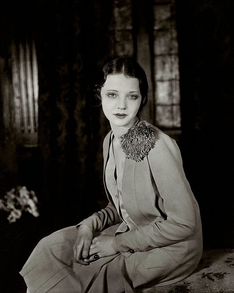 #2 Sylvia Sydney wearing a light dress, with a pom-pom on the left shoulder, looking with dreamy eyes, 1927.