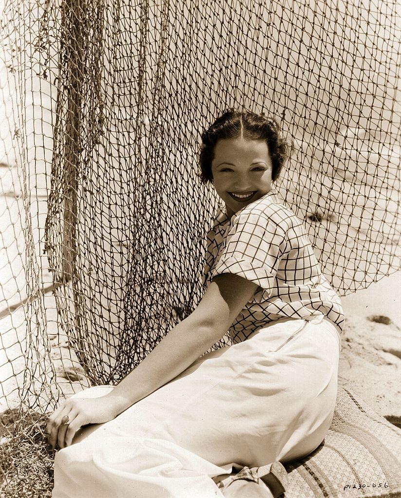 #49 Sylvia Sidney on the beach in front of her Malibu home, 1935.