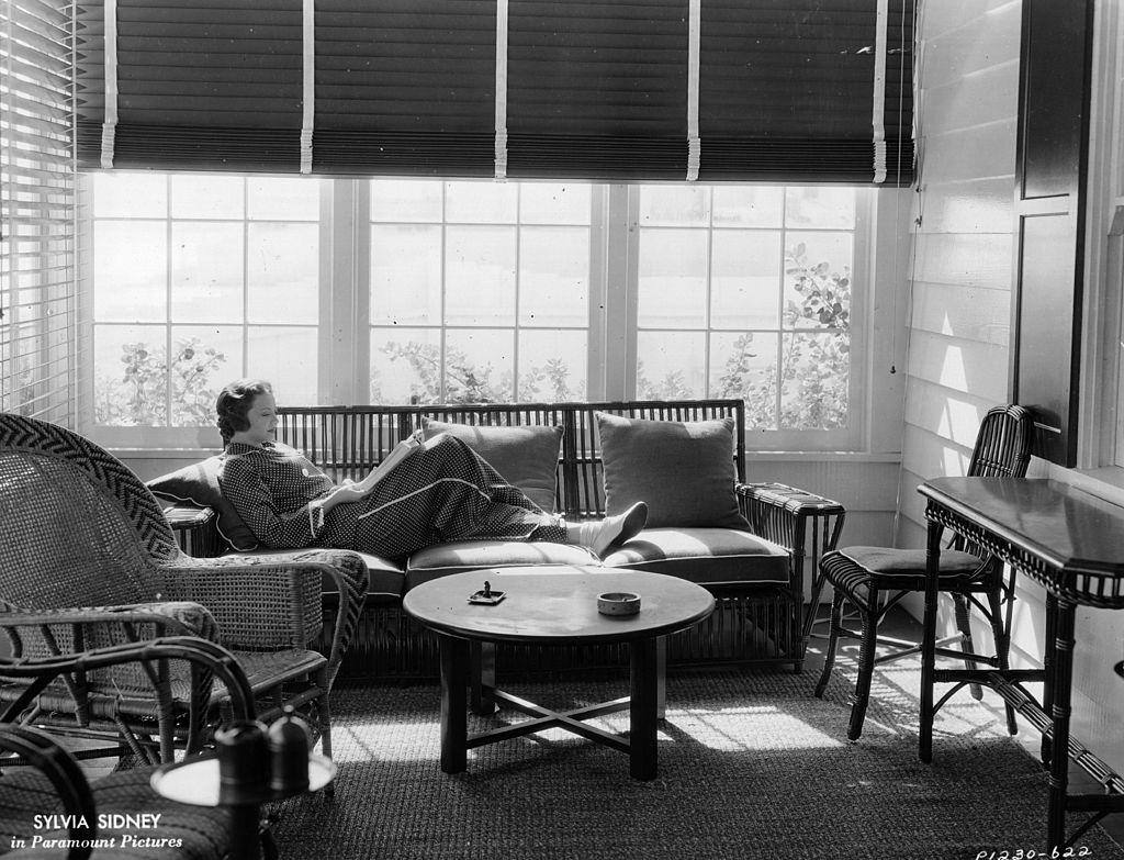 #53 Sylvia Sidney reading in her beach Malibu home, 1935