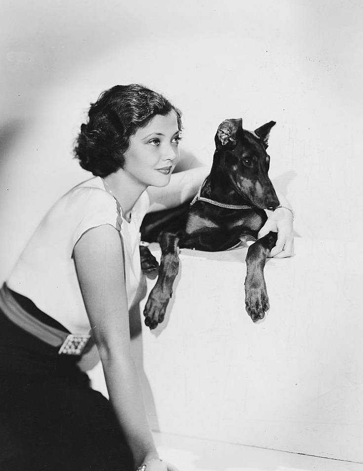 #60 Sylvia Sidney with Doberman Pinscher, 1935.