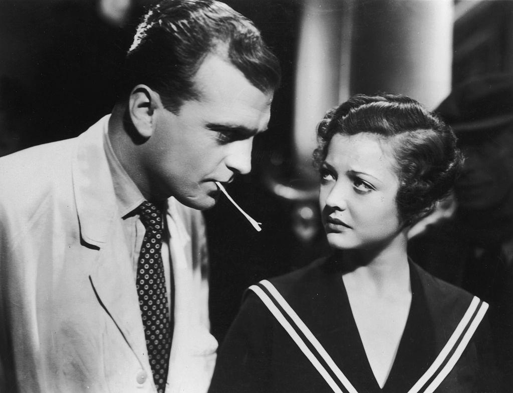 #64 Sylvia Sidney with John Loder in the movie ‘Sabotage’, 1936.