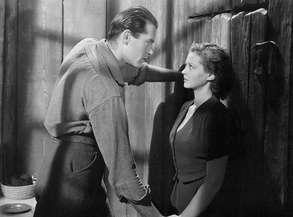 #66 Henry Fonda looking seriously at Sylvia Sidney in a scene from the’The trail of the Lonesome Pine’, 1936.