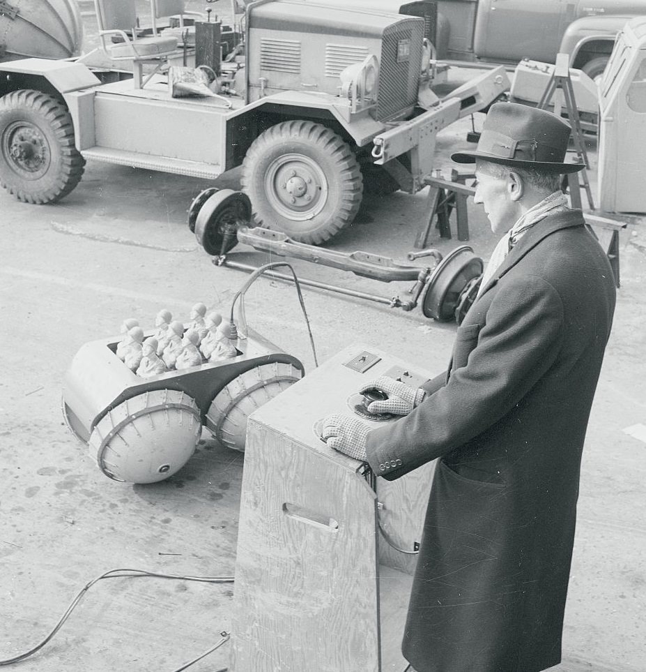 Elie P. Aghnides, demonstrating his invention ‘Baby Rihno’ at Marmon-Herrington Co. Inc.