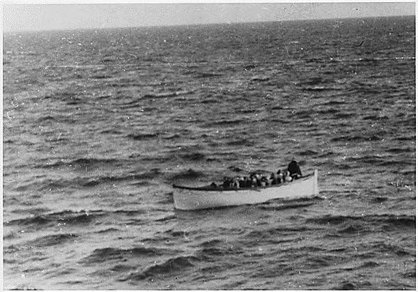 #14 A rescue boat full of survivors makes its way trough the water following the Titanic sinking. April 15, 1912.