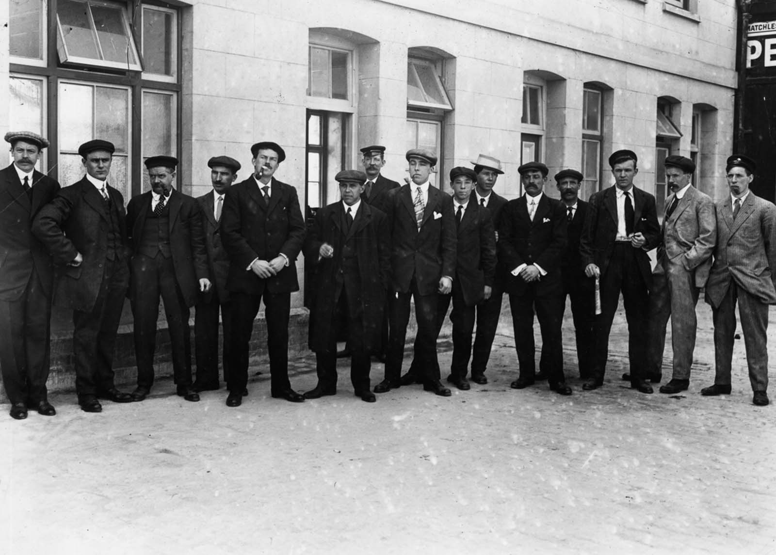 #22 Surviving stewards line up outside a first-class waiting room before being called in for questioning by a board of inquiry.