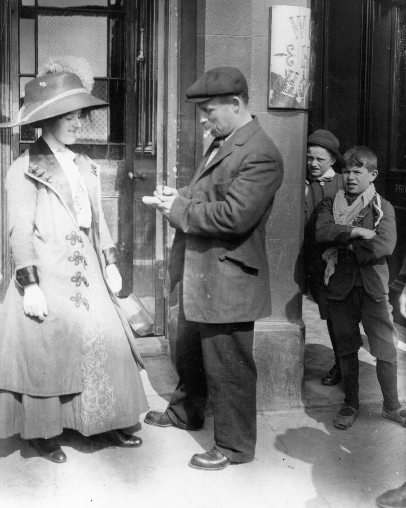 #23 A survivor gives a woman an autograph.
