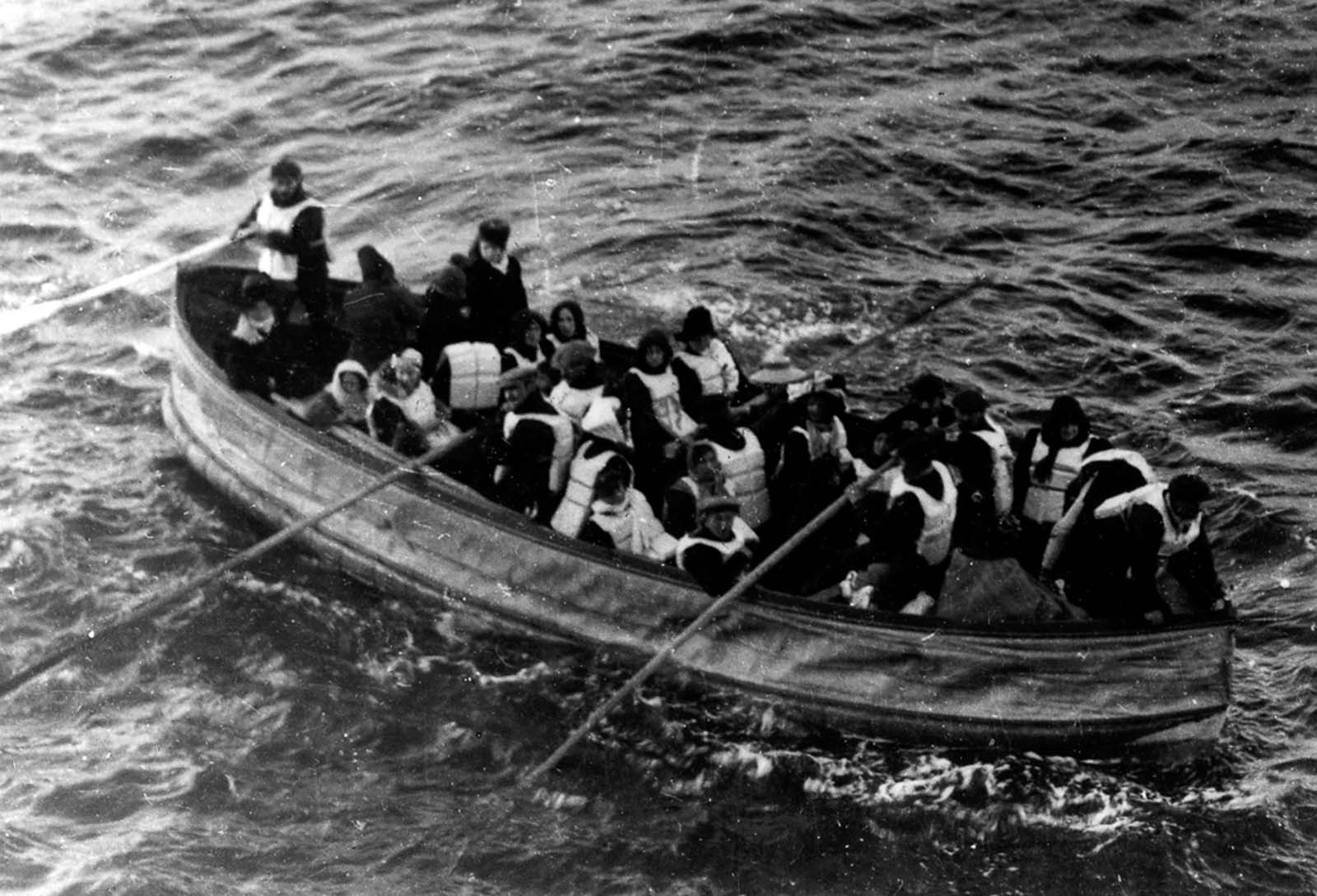 #6 Titanic survivors in a lifeboat.