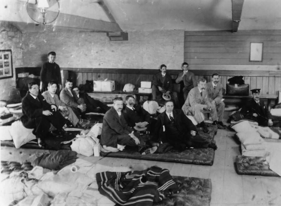 #33 Survivors of the Titanic sinking sit at Millbay Docks in Plymouth, England upon their return home, May 1912.