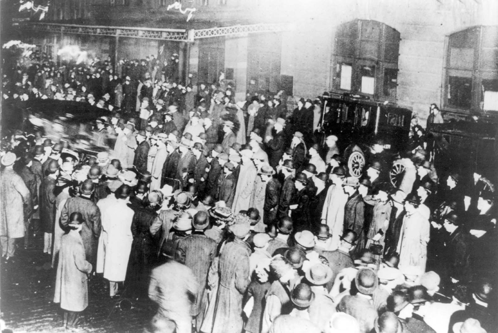 #11 Crowds stand in the rain awaiting the arrival of the Carpathia in New York.