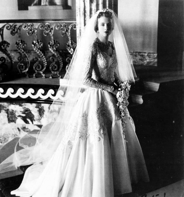 #9 Lady Anne Glenconner in wedding gown designed by Norman Hartnell on her wedding day, 1956