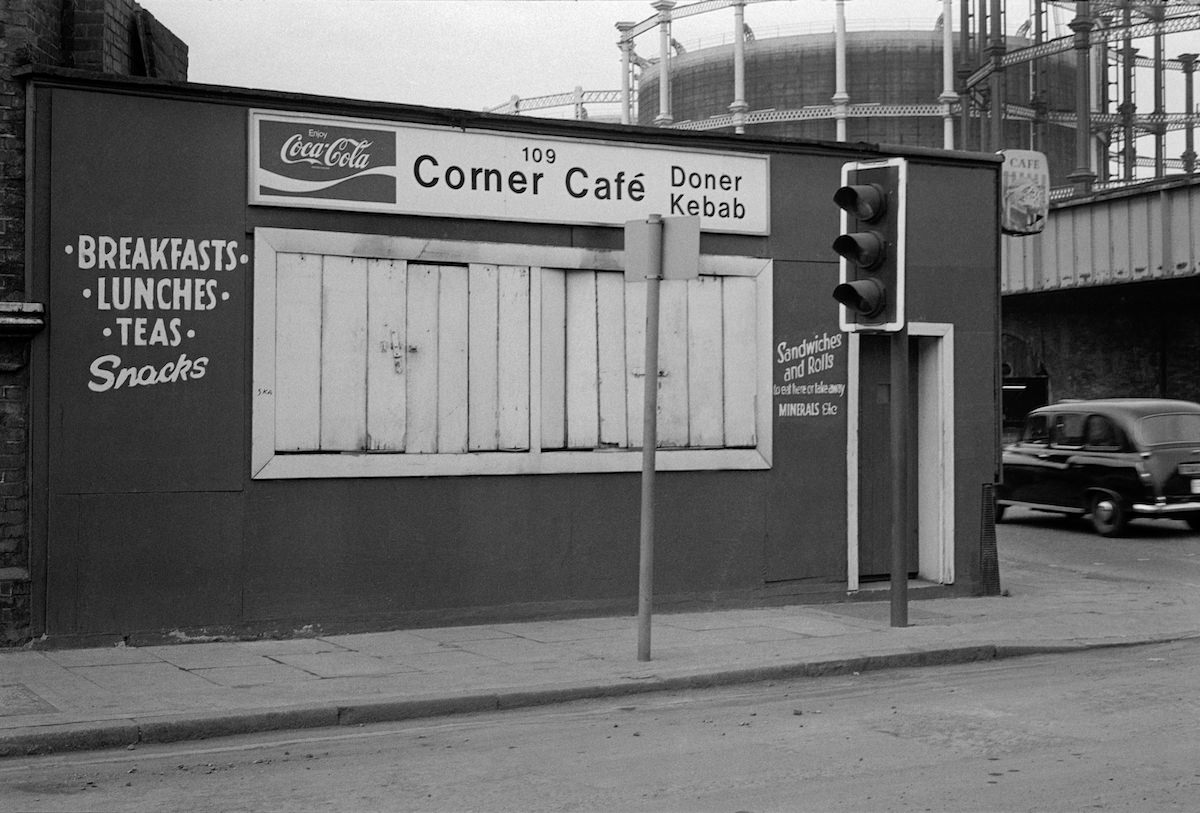 #24 Corner Cafe, Phoenix Rd:Midland Rd and gas holders, Camden, 1980