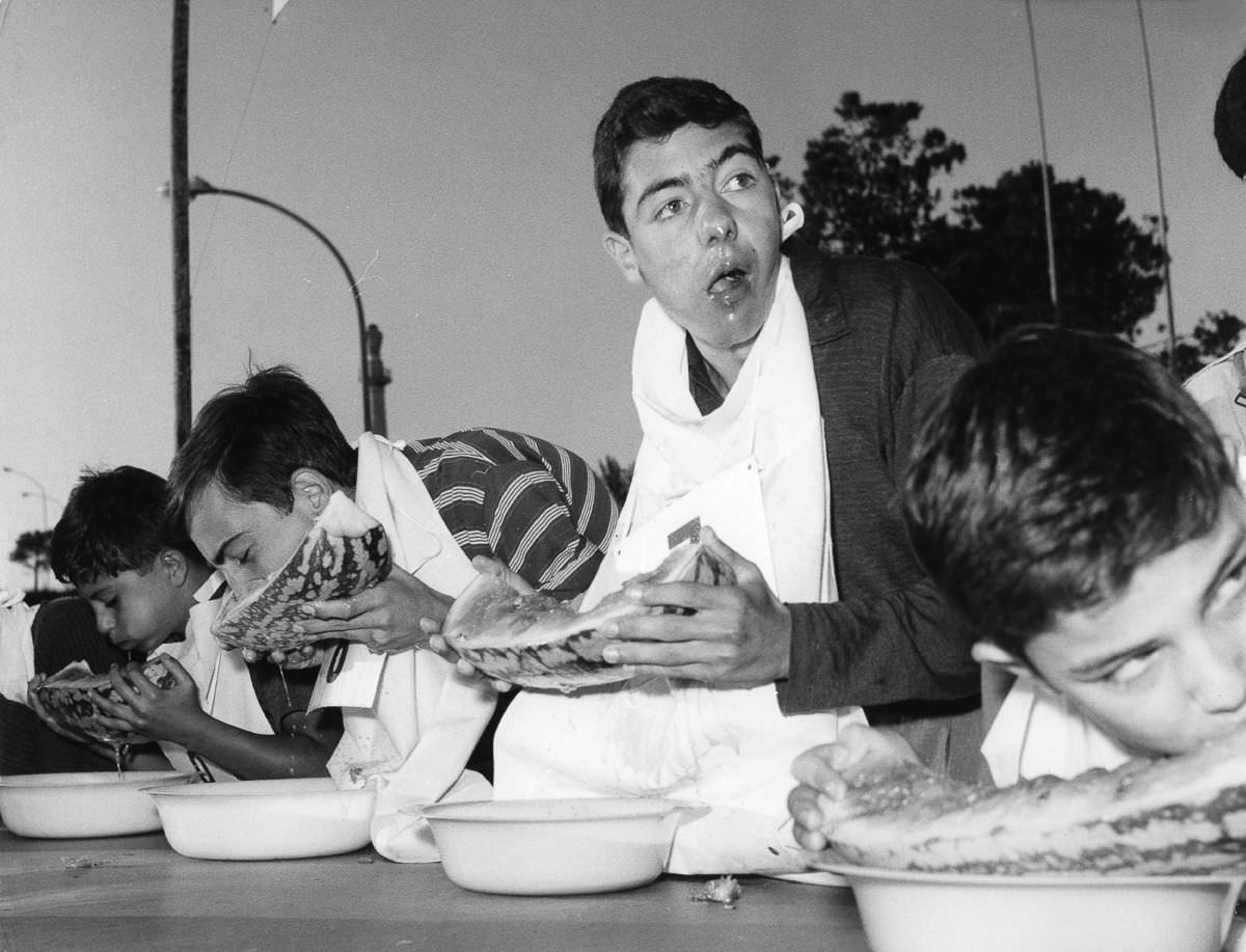 #18 A watermelon-eating contest in Rome, Italy, 1950.