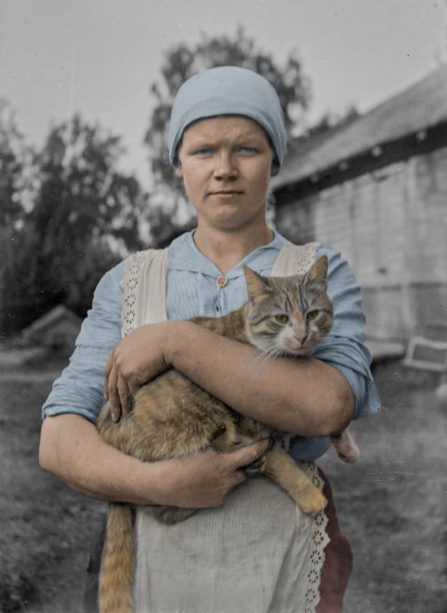 #11 A young woman and a cat photographed by the Finland-Swedish poet Edith Södergran, 1910s