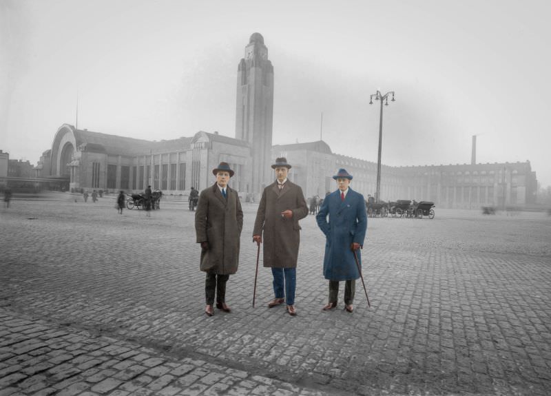 Three gentlemen posing in front of Helsinki’s new railways station, 1900s.