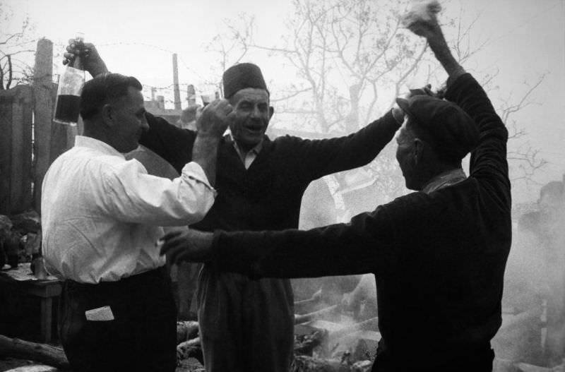 Three peasants cheering.