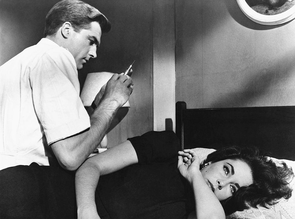 Elizabeth Taylor is shown about to receive a sedative from a man with a syringe in the movie “Suddenly Last Summer,” 1959.