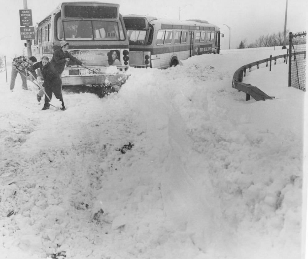 #15 Weary shovelers struggle to free two buses that blocked an entrance to the Staten Island Expressway for two hours, a common sight all along the highway.