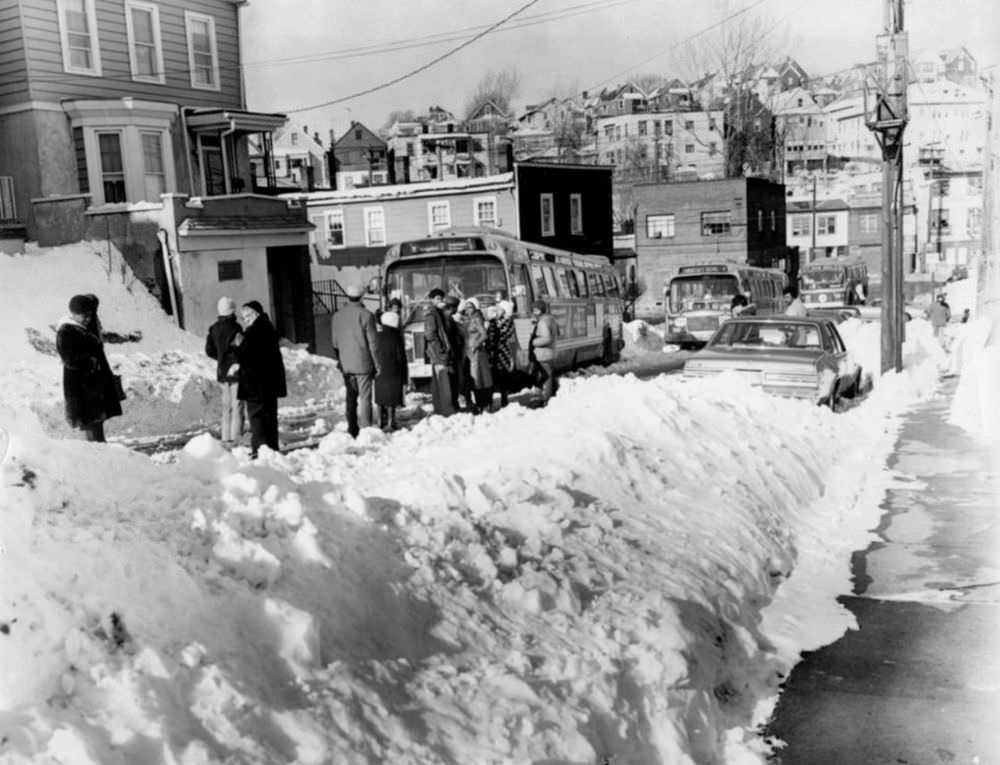#3 February 9, 1978, some of these people had a long wait for the bus on Victory Boulevard. in Tompkinsville, only to have it get stuck in the snow around the corner after they boarded.