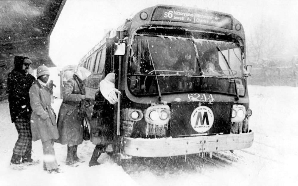 #22 Passengers board the S-6 bus on Bay St., near the ferry, during a blizzard on February 6-7, 1978.