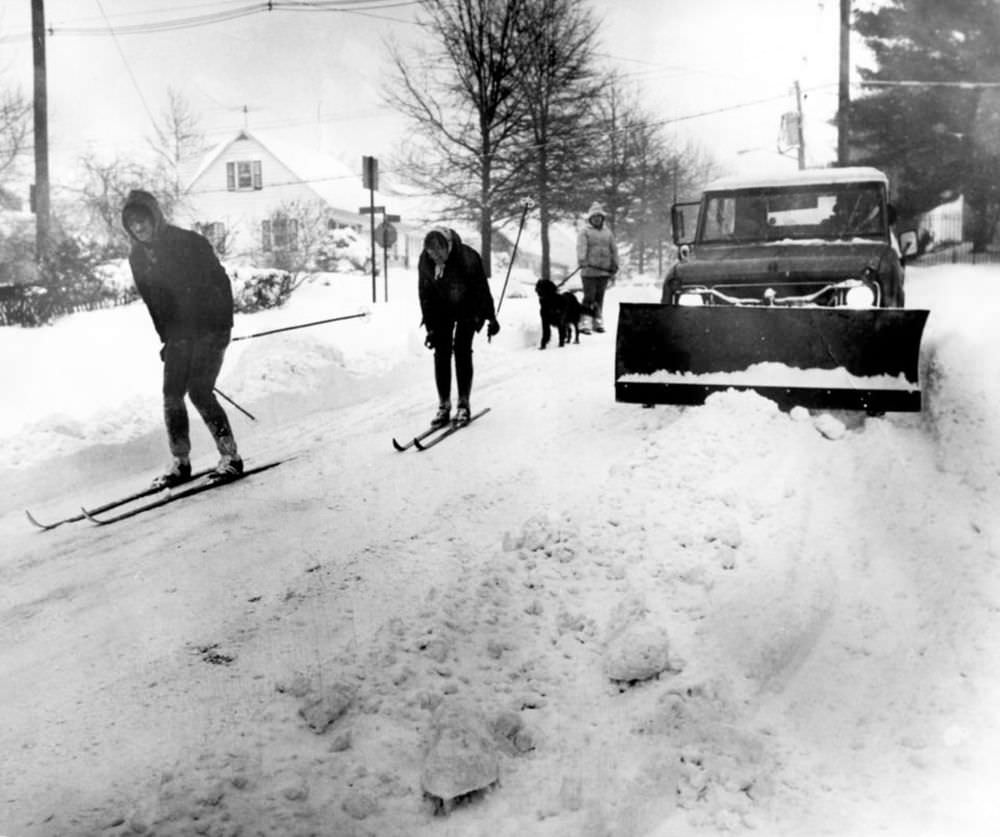 #25 On February 6, 1978, skis were a good way to get around, as this couple demonstrates on Kingsley Street in West Brighton.