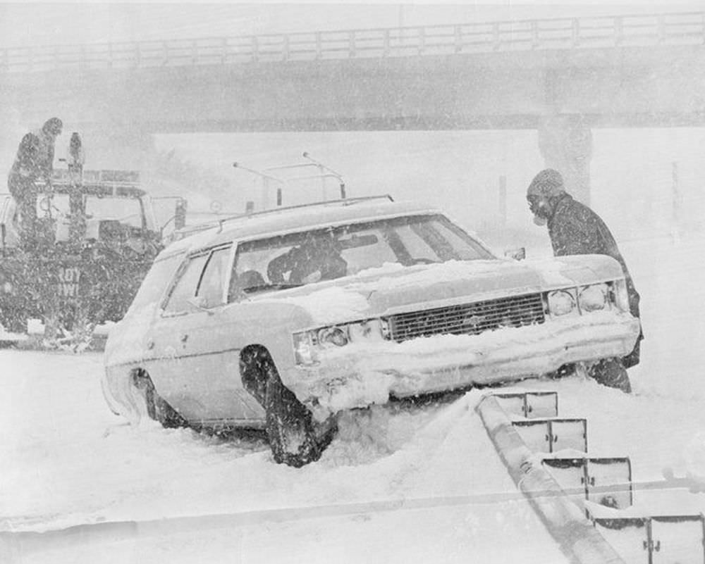 #5 A car rest on top of the Indian Orchard exit of I-291 east in Springfield on Feb. 7, 1978.