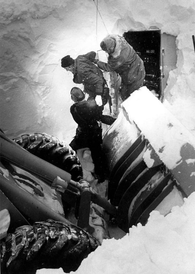 #41 Truck driver James Truly is helped from the cab of his rig after spending most of five days buried in the truck beneath a huge snowdrift in Mansfield, Ohio, Jan. 31, 1978.