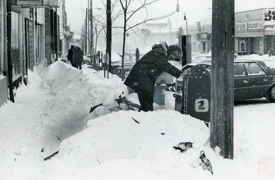 #4 Esther Wright, a clerk for the Ravenna Police Department, trudged through snow drifts to mail a letter on Jan. 27, 1978.