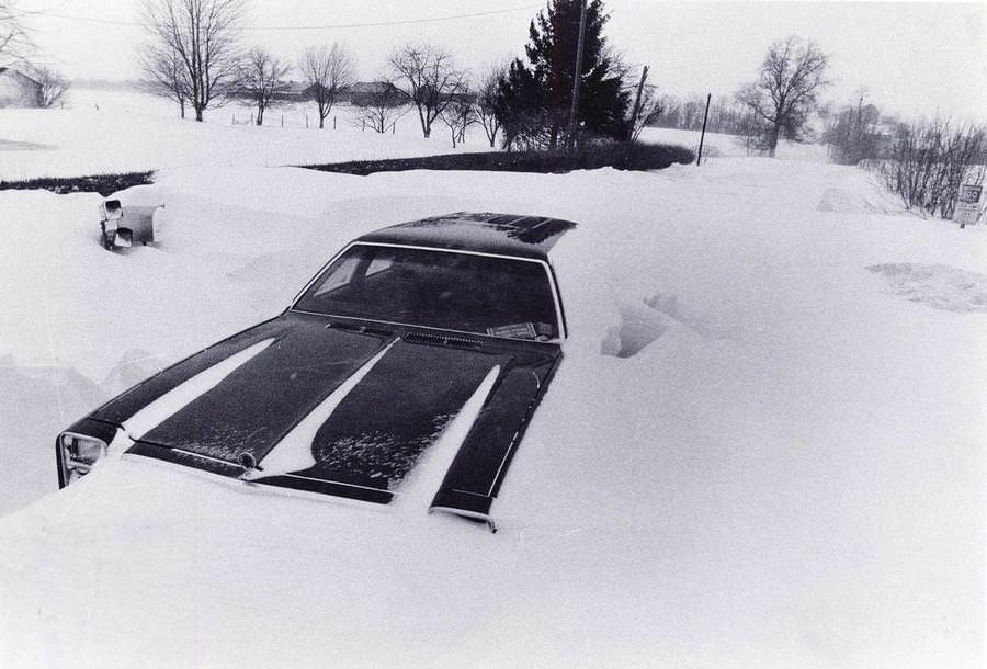#54 An abandoned car lies buried in a giant snowdrift on Jan. 27, 1978, off Eastern Road near Rittman in Wayne County.