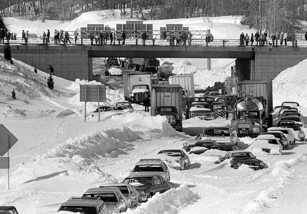 #8 Cars and trucks are stuck and can only wait as Army and civilian plows and tow trucks approach from bridge Thursday Feb. 9, 1978 on Route 128, Dedham, Mass.